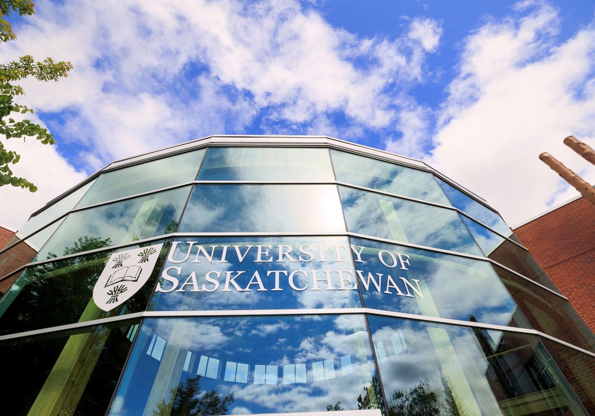 A close up photo of a glass atrium with the University of Saskatchewan logo at the front of the Prince Albert Campus.