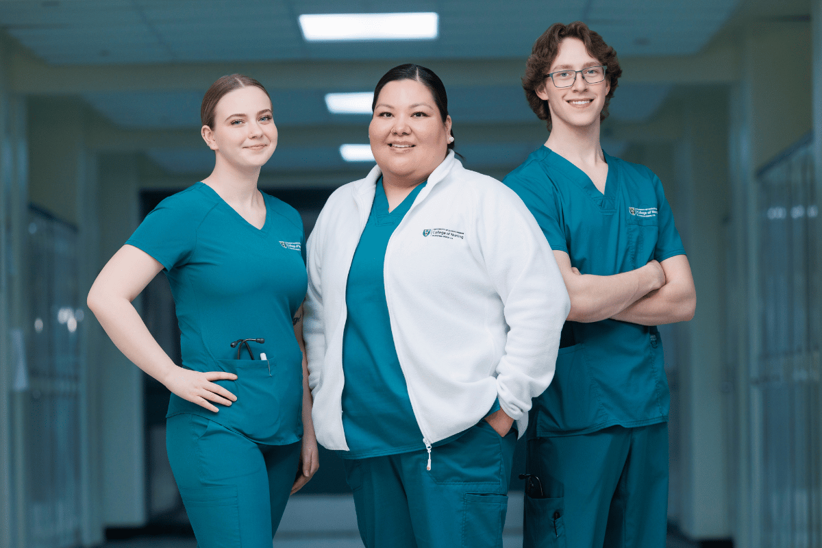 female nursing student in white scrubs 